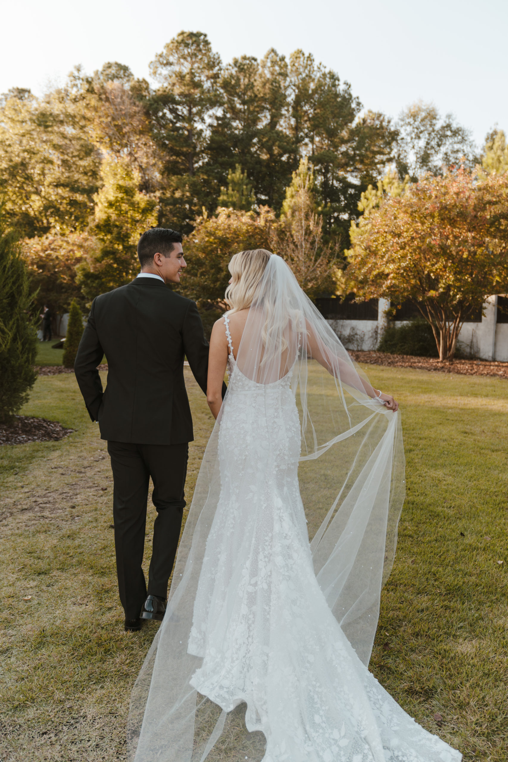 bride and groom walking away